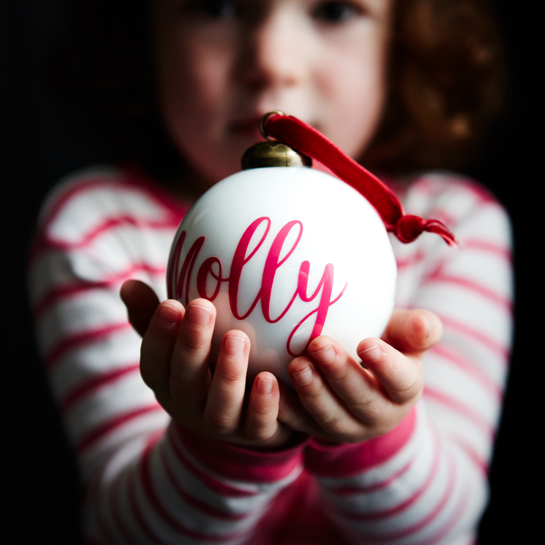 HMC 2017 - Child holding personalised bauble Square